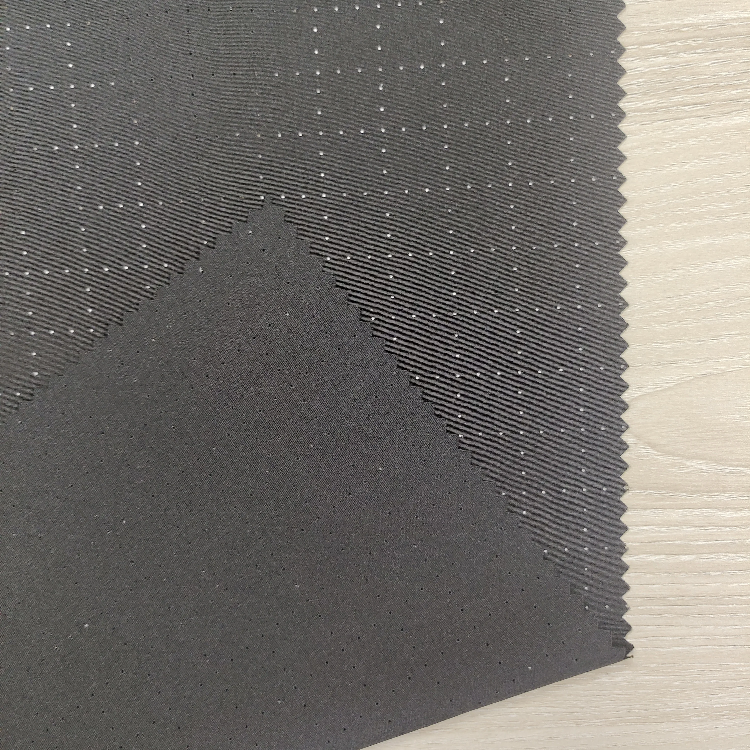 Wholesale Lightweight Breathable 100D 4 Way Stretch Punched Fabric for Summer Garments