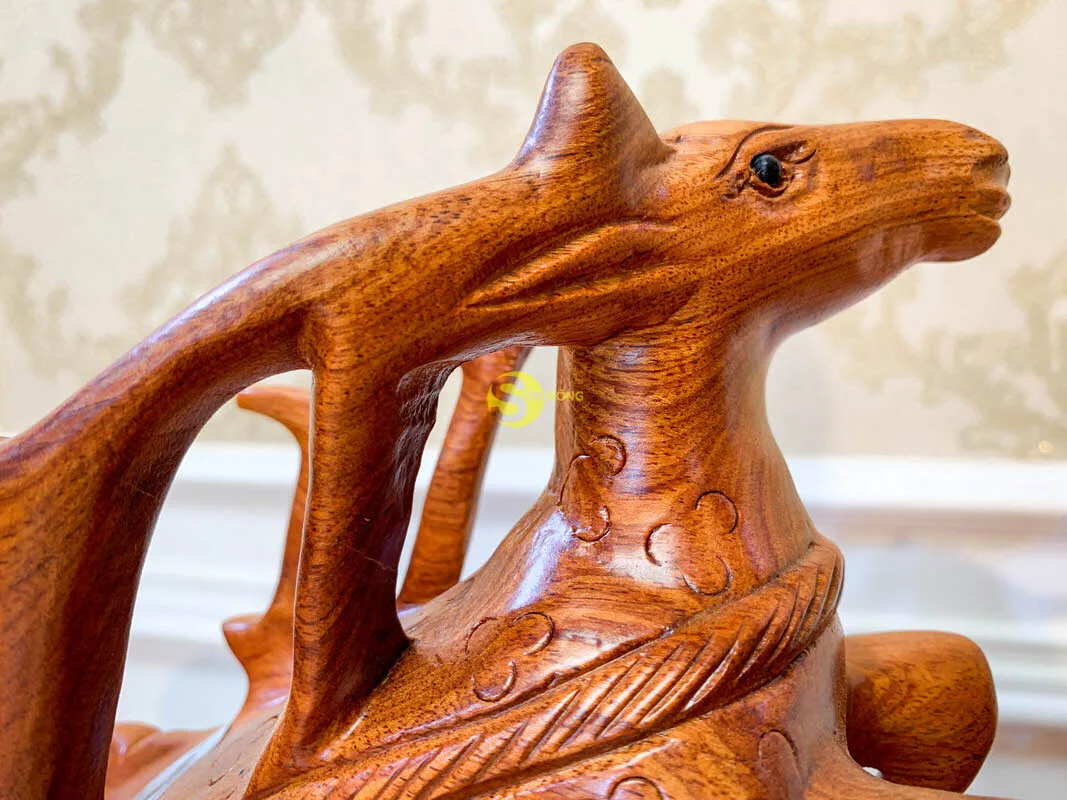 Reindeer pull cart carrying bottles of wine