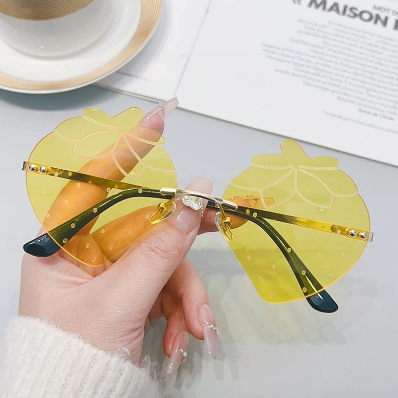 Trendy Unisex Gold Rimless Sunglasses with UV400 Red Lenses Strawberry Style Fashionable Eyewear for Parties
