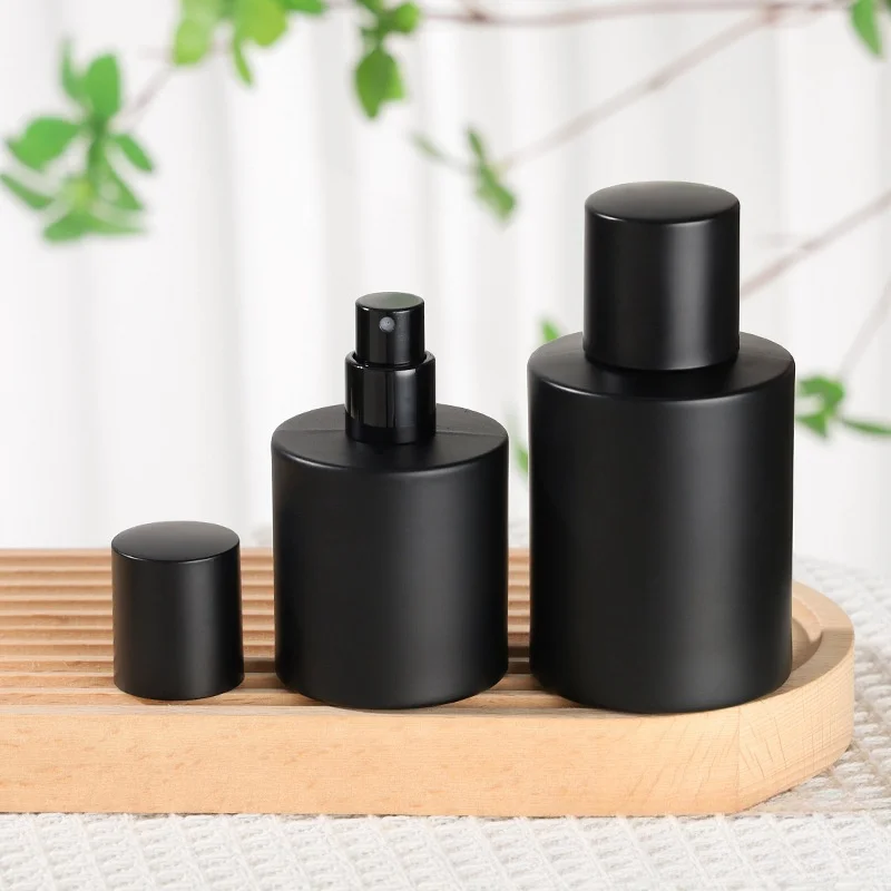 Wholesale Matte Black Glass Perfume Bottle 50ml Round Perfume Glass Bottle With Black Cap
