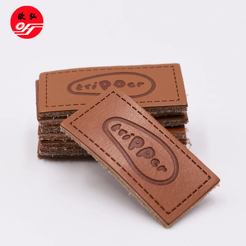 
Good Style Customized Debossed Brand Name Brown PU Leather Badge Patch for Clothing 
