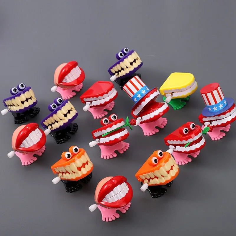 Wholesale Children Creative Novelty Promotion gifts Cartoon Plastic  teeth Wind-Up Jumping toy for Kids