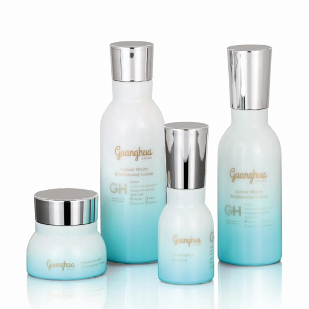 Blue glass bottle with pump and silver cap for lotion and serum