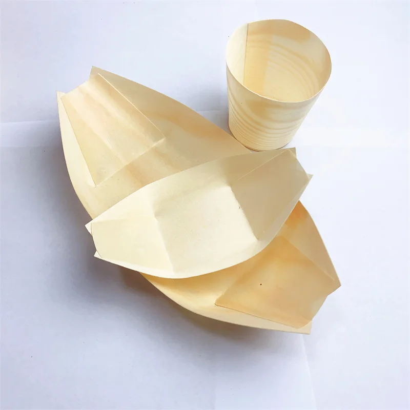 Eco-friendly wooden boat plates, biodegradable, suitable for holding various delicacies and displaying at parties.
