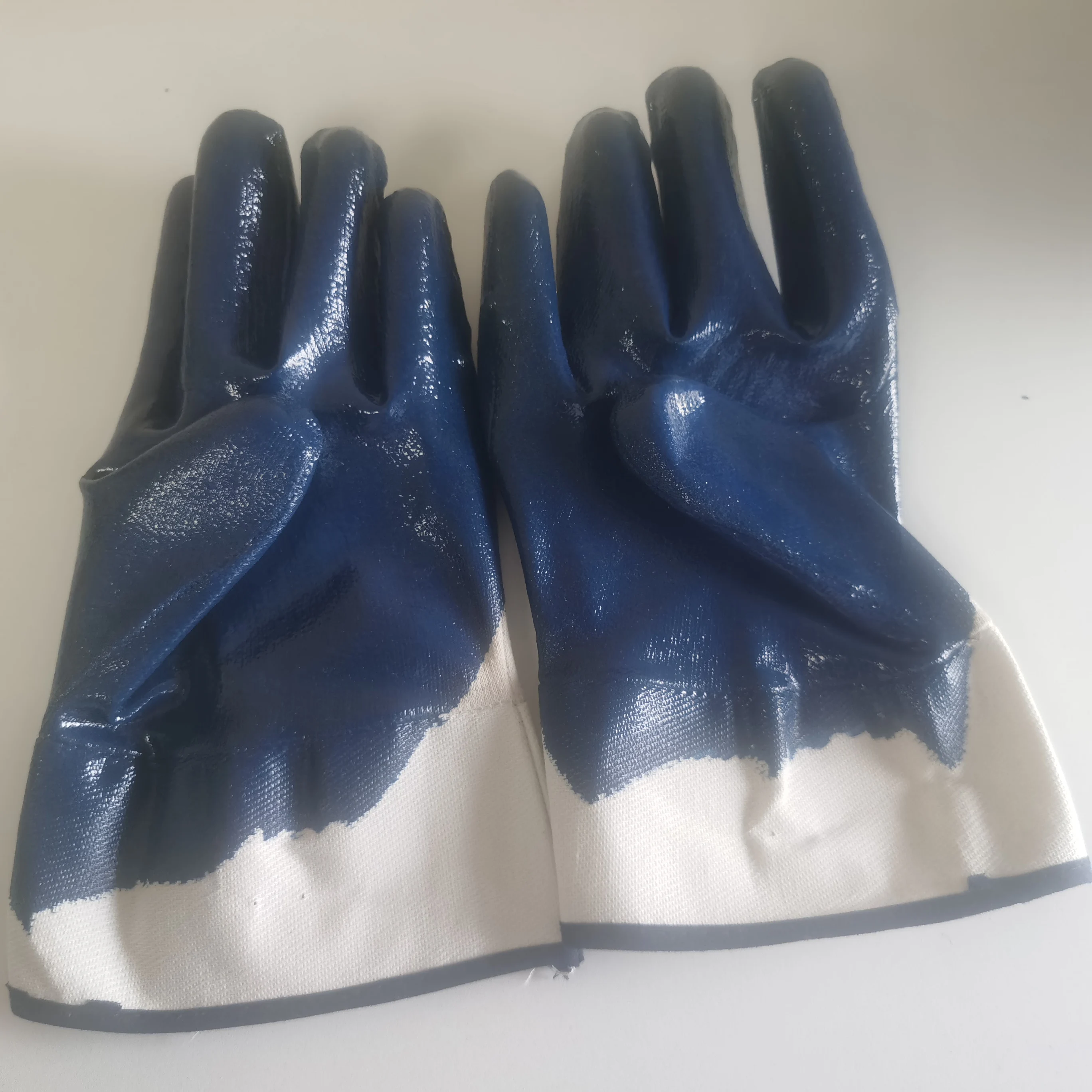 
bule nitrile coated with jersey liner smooth finish with safety cuff gloves 