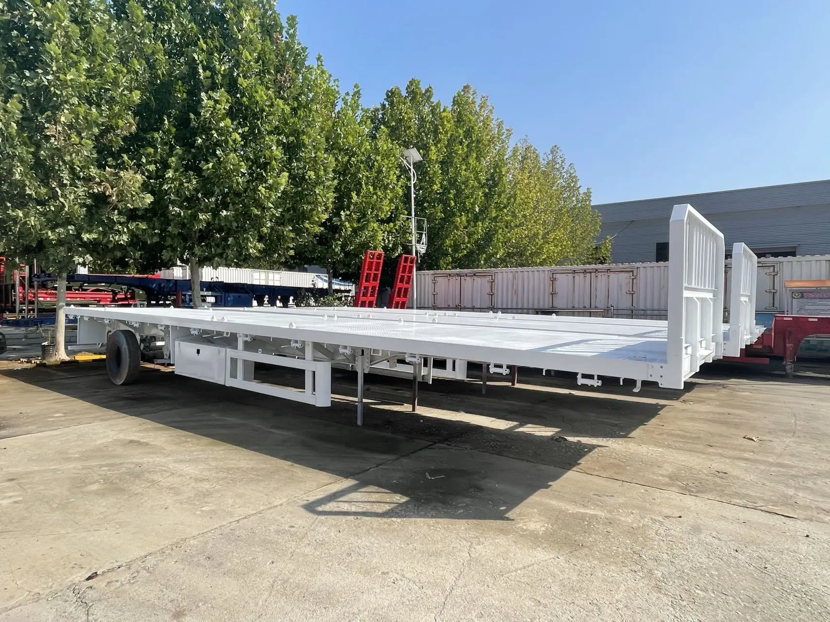 China Factory Lowest price New 3/4 Axle Flatbed Container Heavy Duty Cargo Transport with Front Wall and Lock Semi Trailer