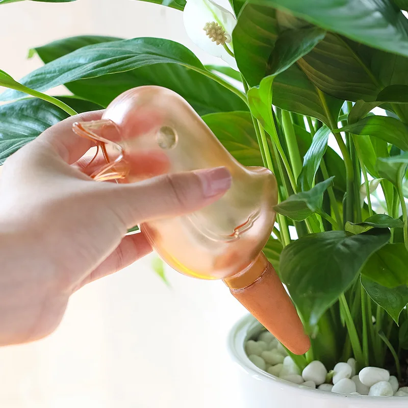 
2021 new transparent automatic dripper gardening household automatic watering bird shape lazy watering flower pot product description