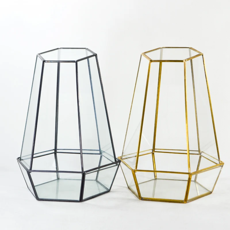 Glass plant container with copper frame