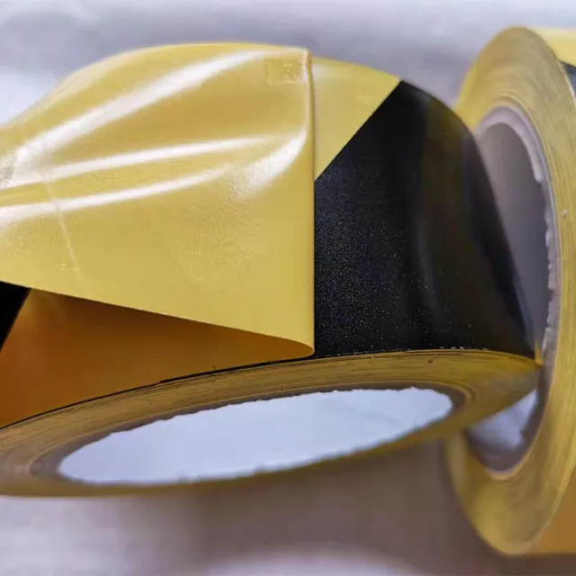 A grade PVC material  Warning Tape floor Caution tape Black Yellow Warning tape jumbo roll with rubber glue coated