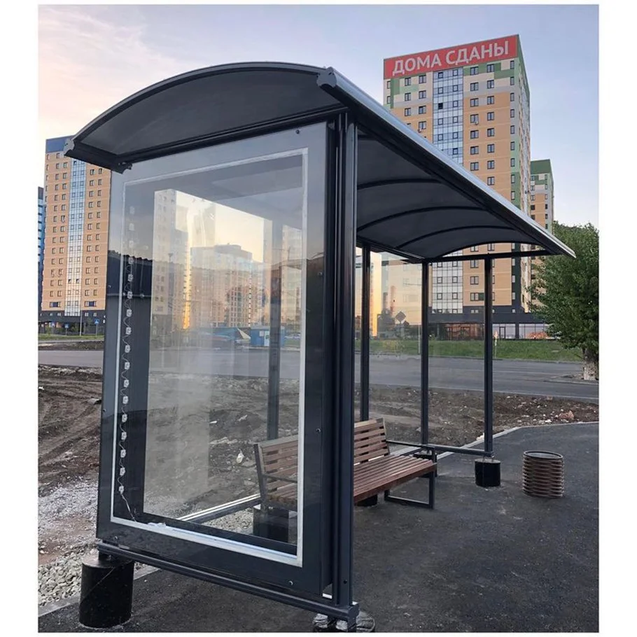 Modern metal Bus Stop Shelter nearby school with digital signage