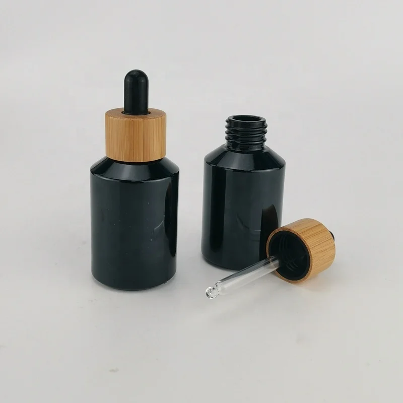 sloping shoulder black glass bottle 60 ml black glass container 2 oz cosmetic bottle with bamboo closure for cosmetic packaging