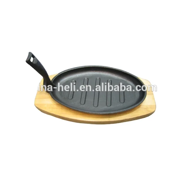 
cast iron sizzler plate with wooden base 