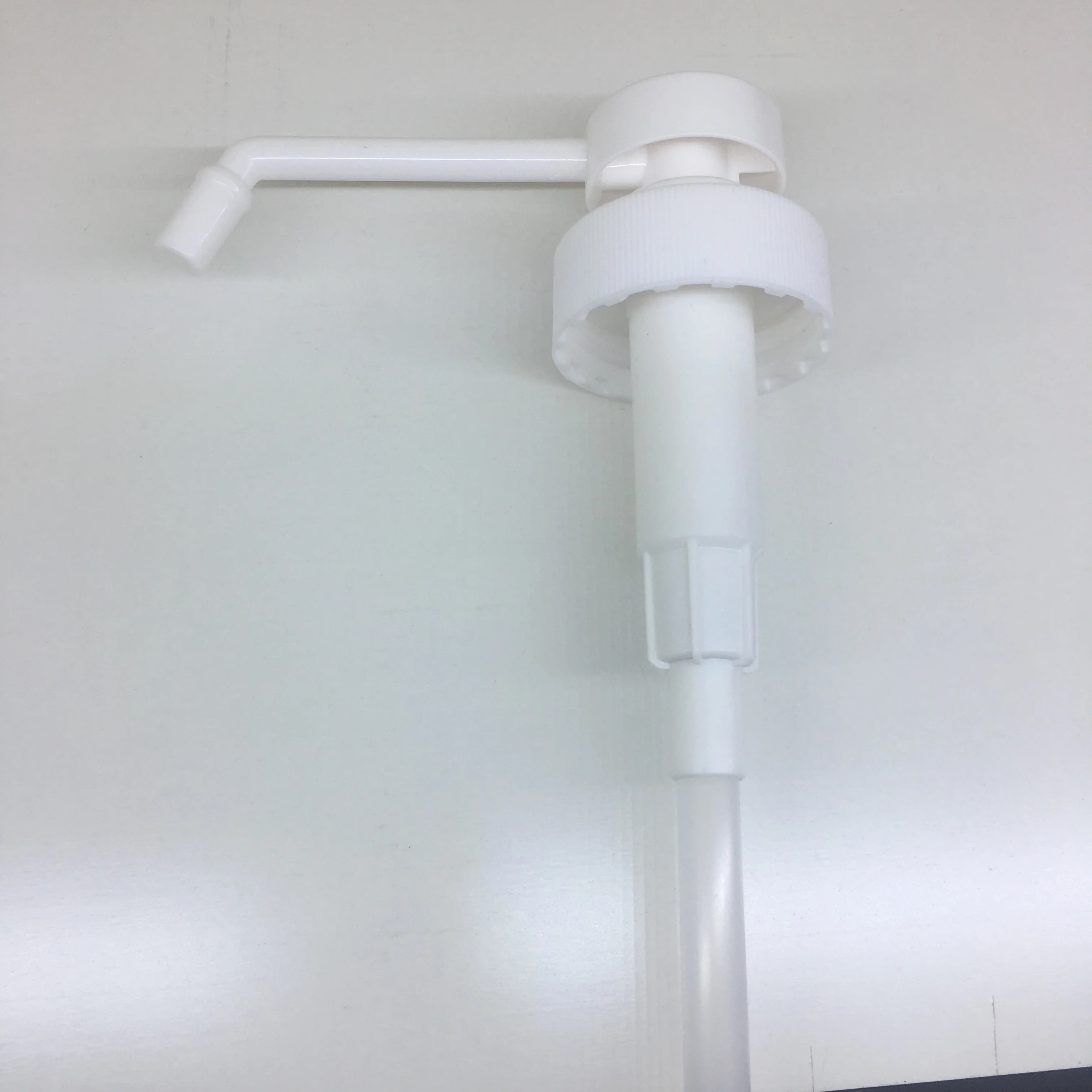 White PP 38-400 sanitizer sprayer dispensing pump with 11 inch dip tube for 1 gallon bottle