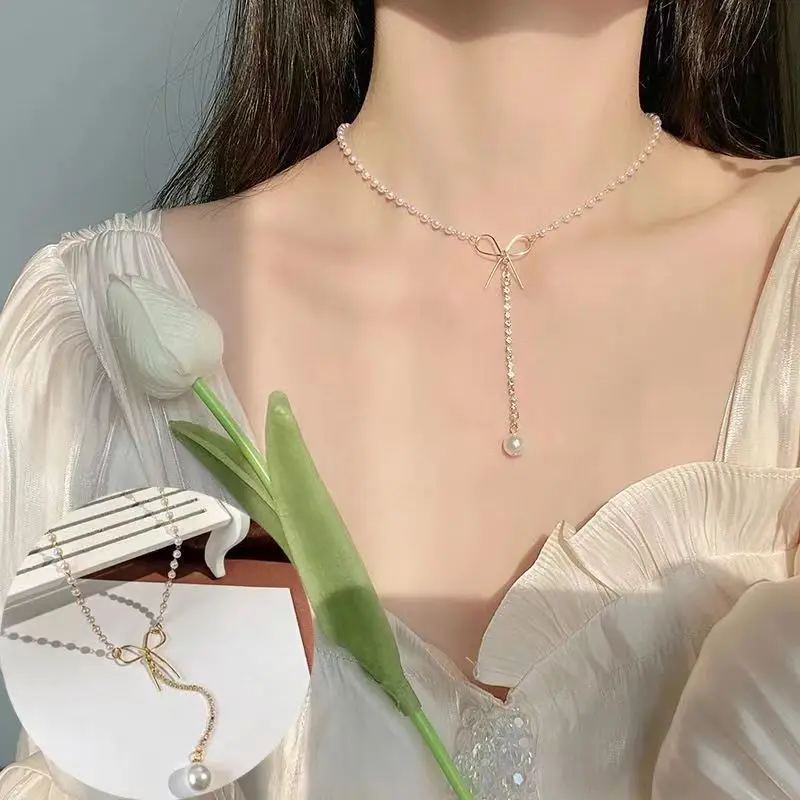 Женское ожерелье с жемчугом и бабочкой