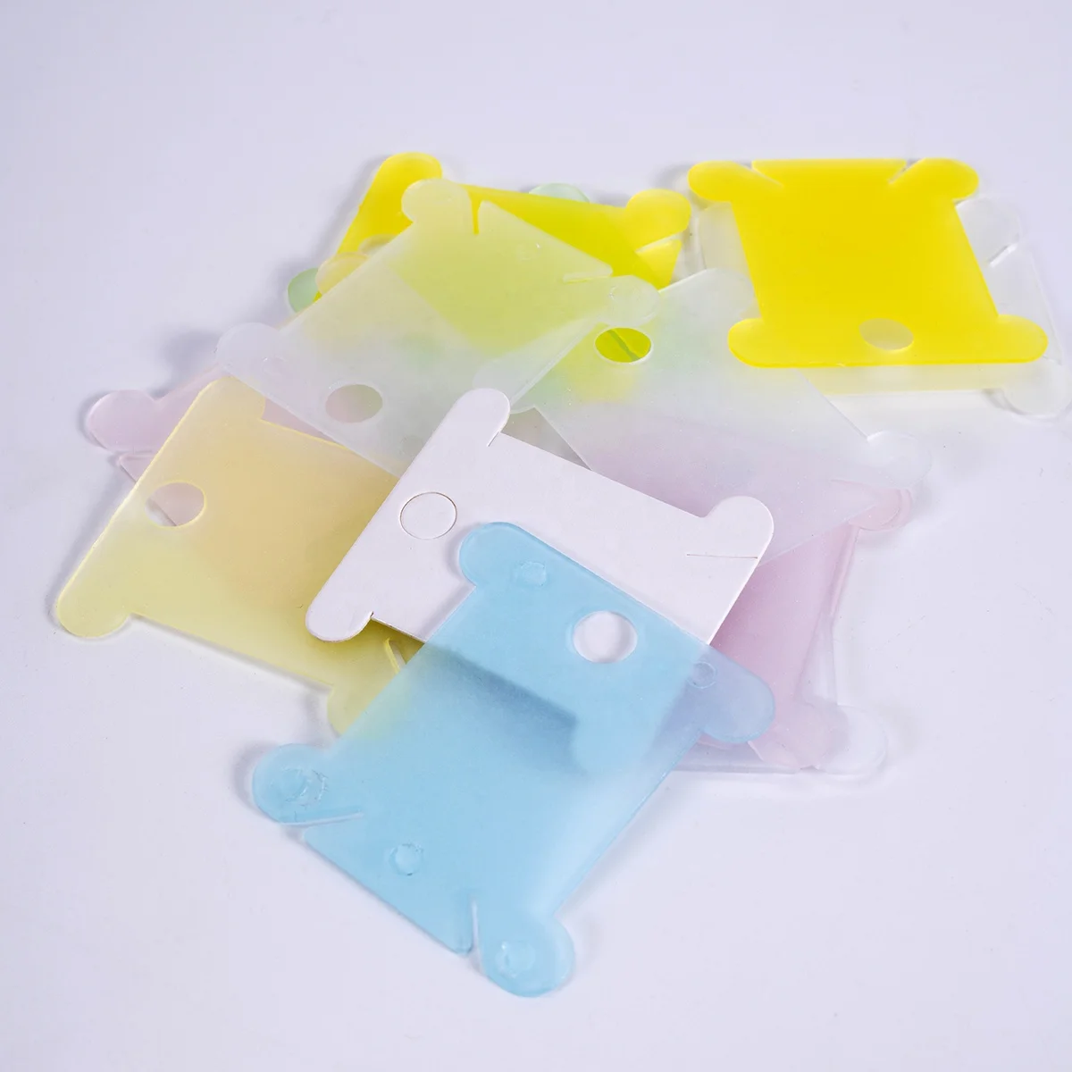 wholesale plastic bobbins thread board price high quality cheap price rainbow colorful transparent floss bobbins