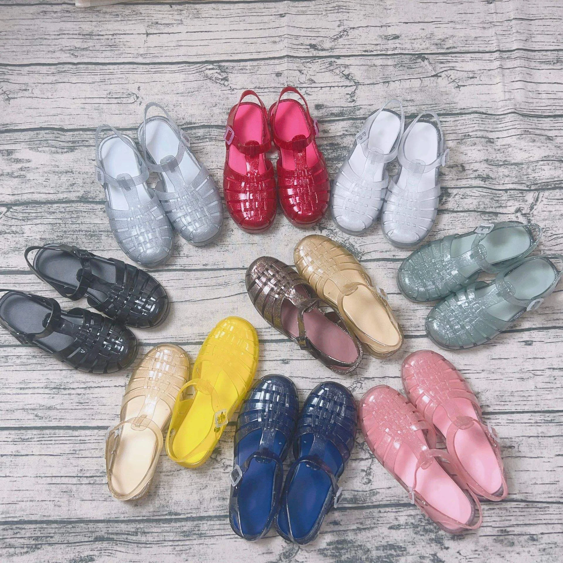 Hot sale wholesale transparent OEM buckle hollow fashionable jelly gladiator outdoor beach roman shoes women flat sandals