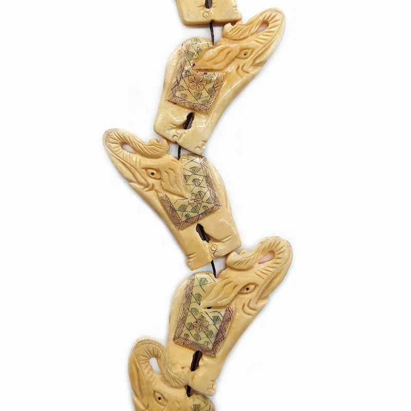 Daning assorted sizes colors exquisite HANDCARVED natural cattle bone running elephant beads pendants for jewelry making