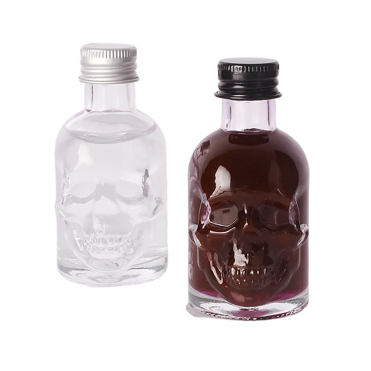 Wholesale 50ml Skull shape small sample alcoholic beverage bottle glass wine bottle with lids