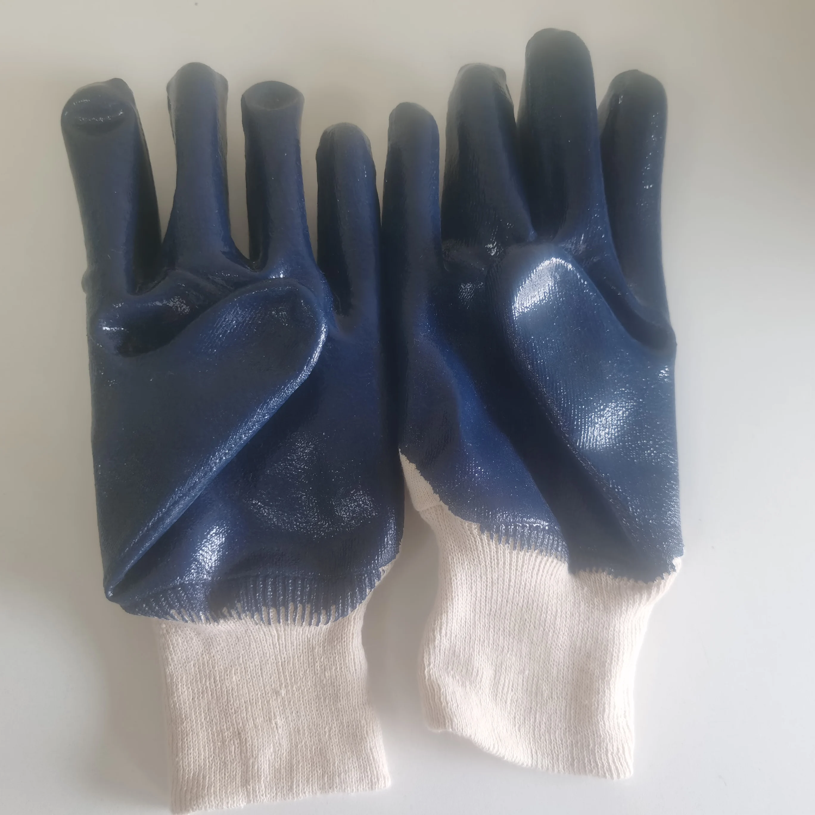 
bule nitrile coated with jersey liner smooth finish with knit wrist gloves 