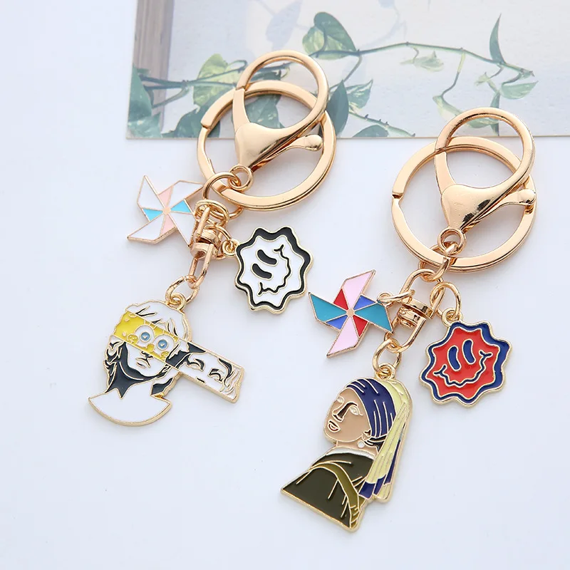 Fashion Split Statue Keychain Creative Character Avatar Dripping Oil Alloy Personality Bag Pendant Wholesale