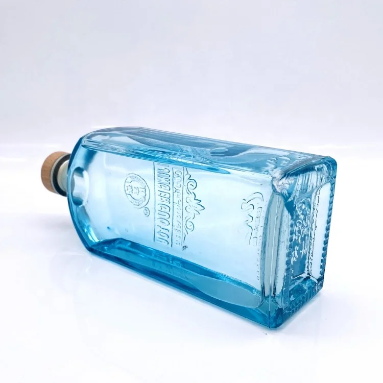 Manufacturer Sale Blue Embossed Logo 750ml Liquor Vodka Spirit Gin Glass Bottles With Wide Neck Whiskey
