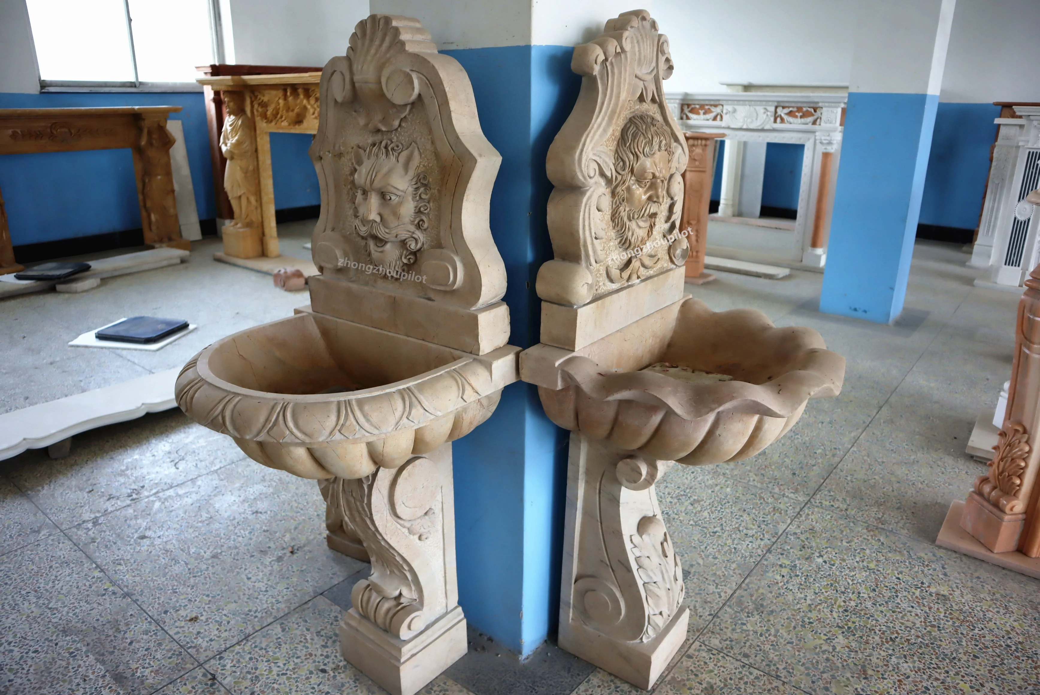 Indoor and outdoor red and beige stone small waterfall wall man head water fountain