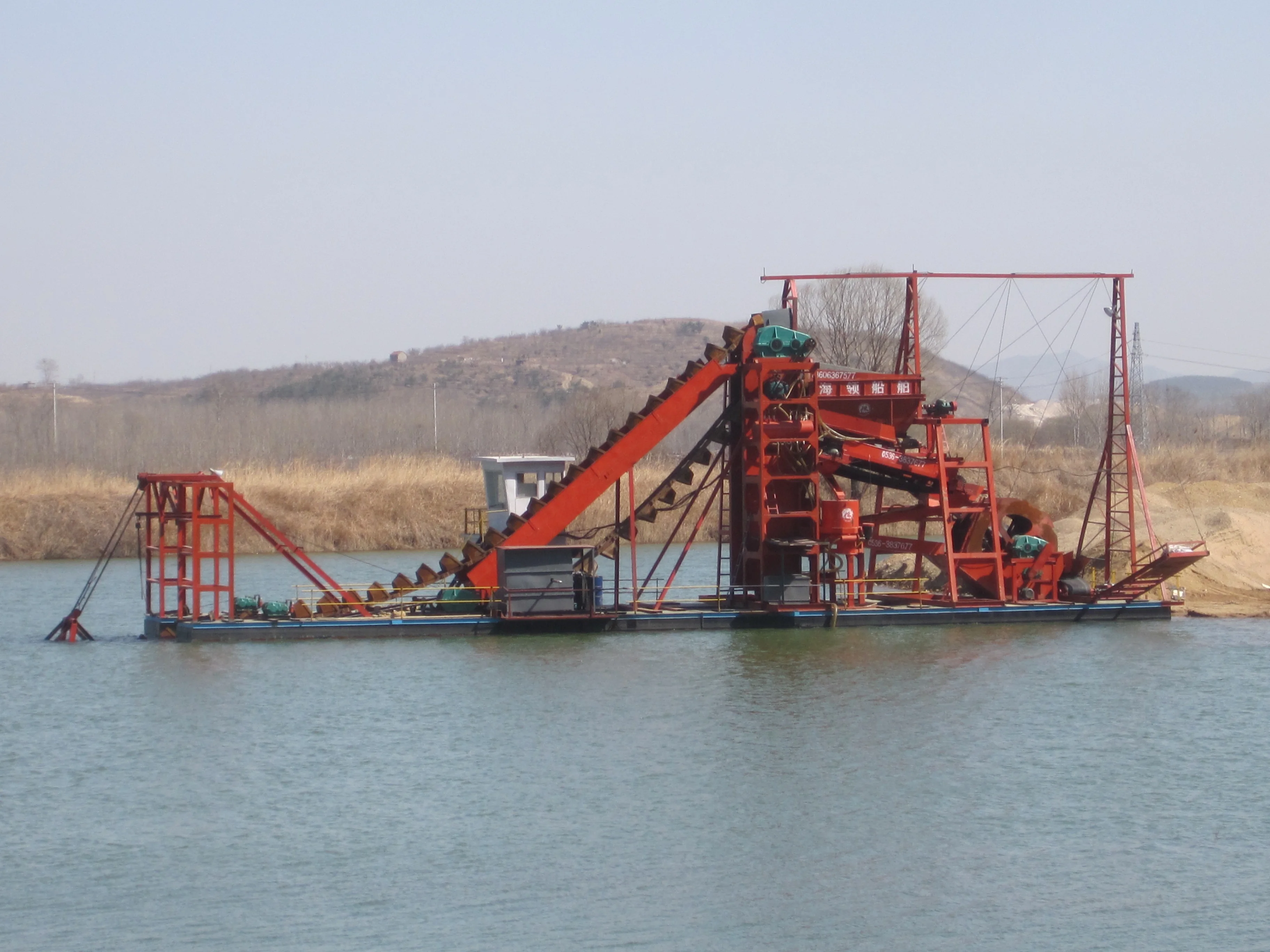 HIKOS chain bucket dredger floating gold dredge for sale