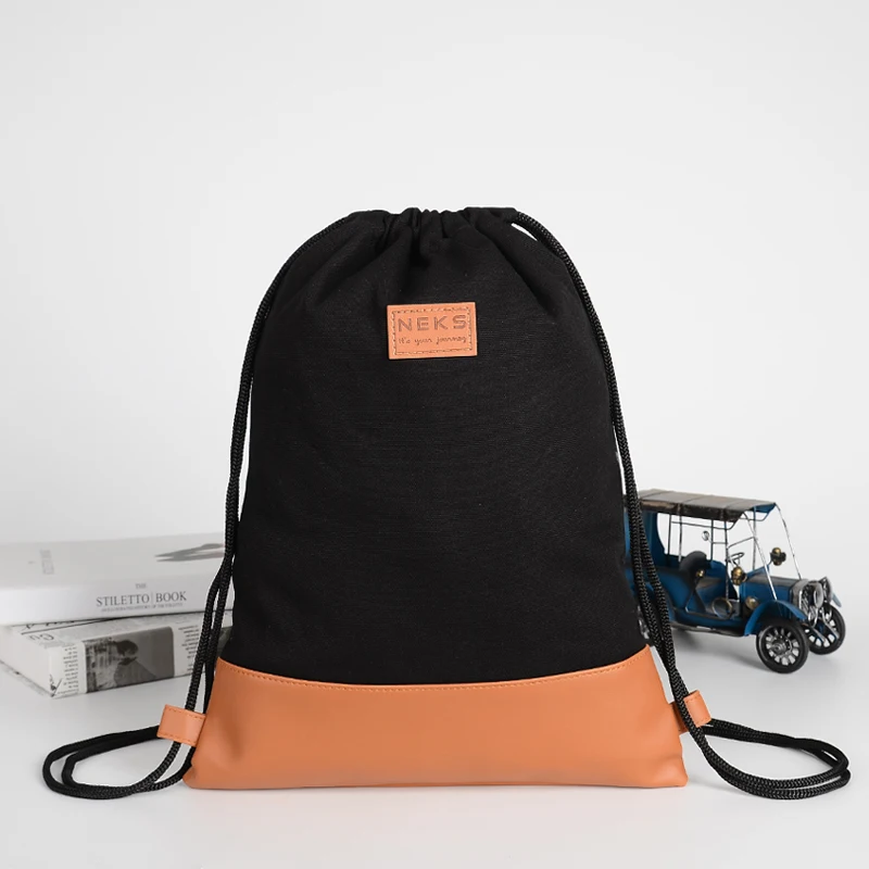 Sturdy and Light Brown PU Joint Black Canvas Gym Bag Backpack Style Cotton Drawstring Bag Custom Logo With Outside Pocket