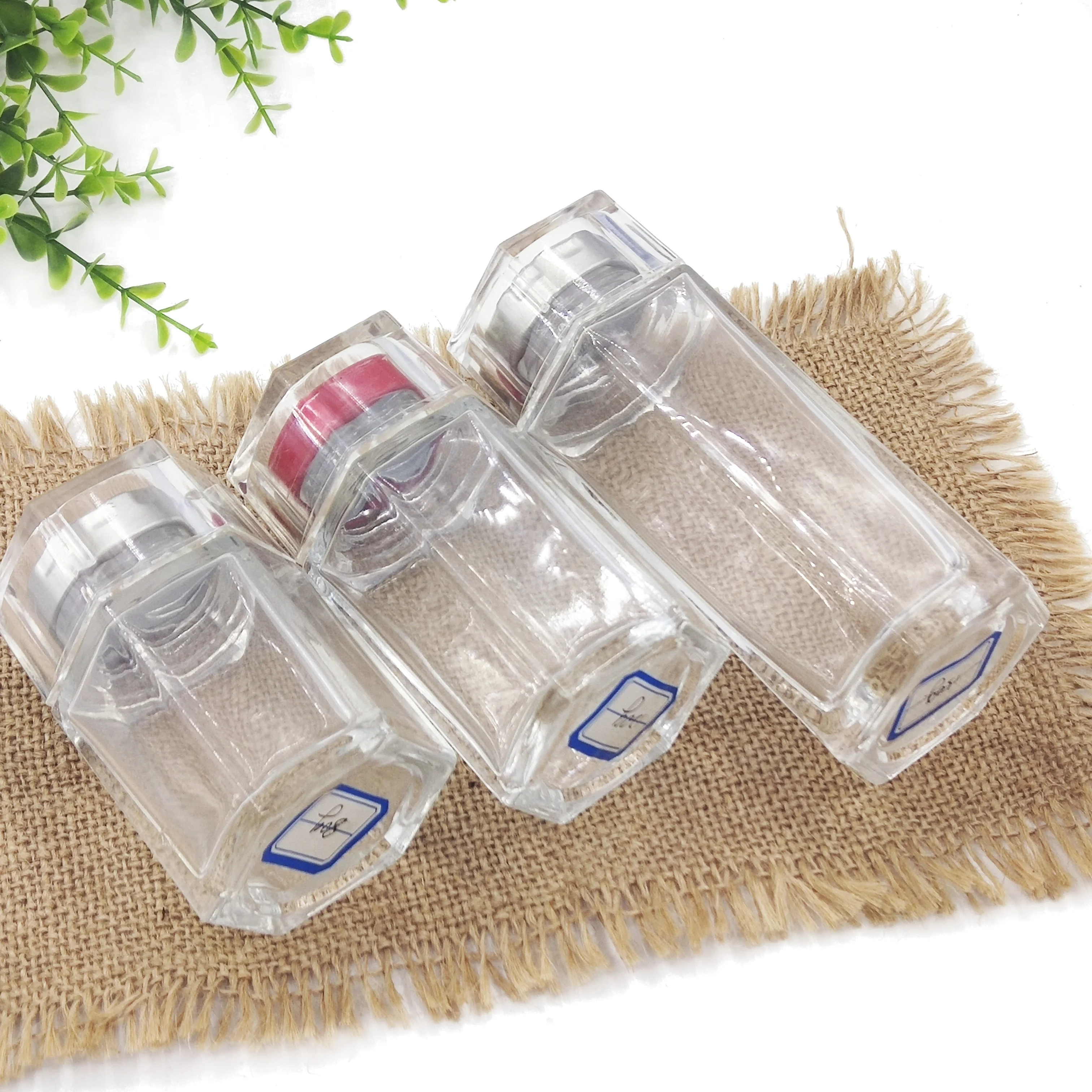 wholesale cheap hexagon food storage honey empty glass jars for canning with lid