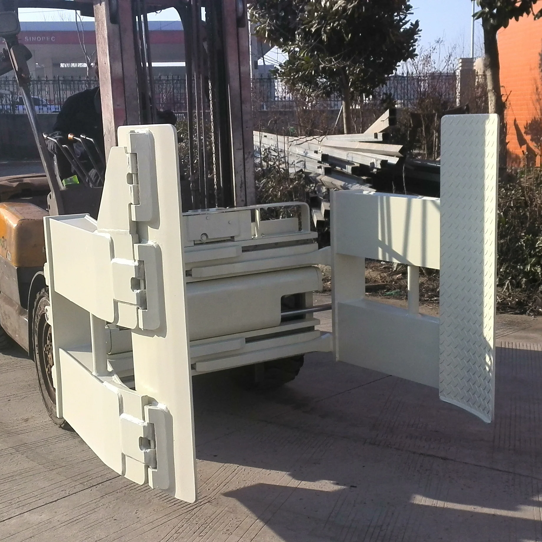 Durable tire clamps forklift attachment used in handling tire