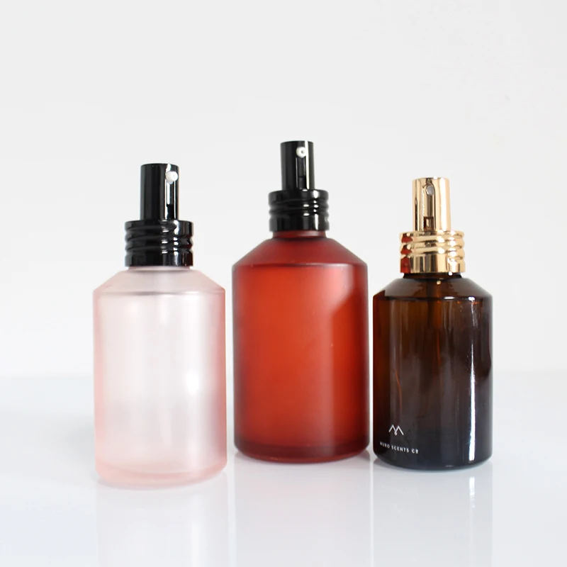 Empty 2 oz and 4 ounce 100ml 120ml matte clear amber glass spray bottle with shinny golden Fine Mist Sprayer