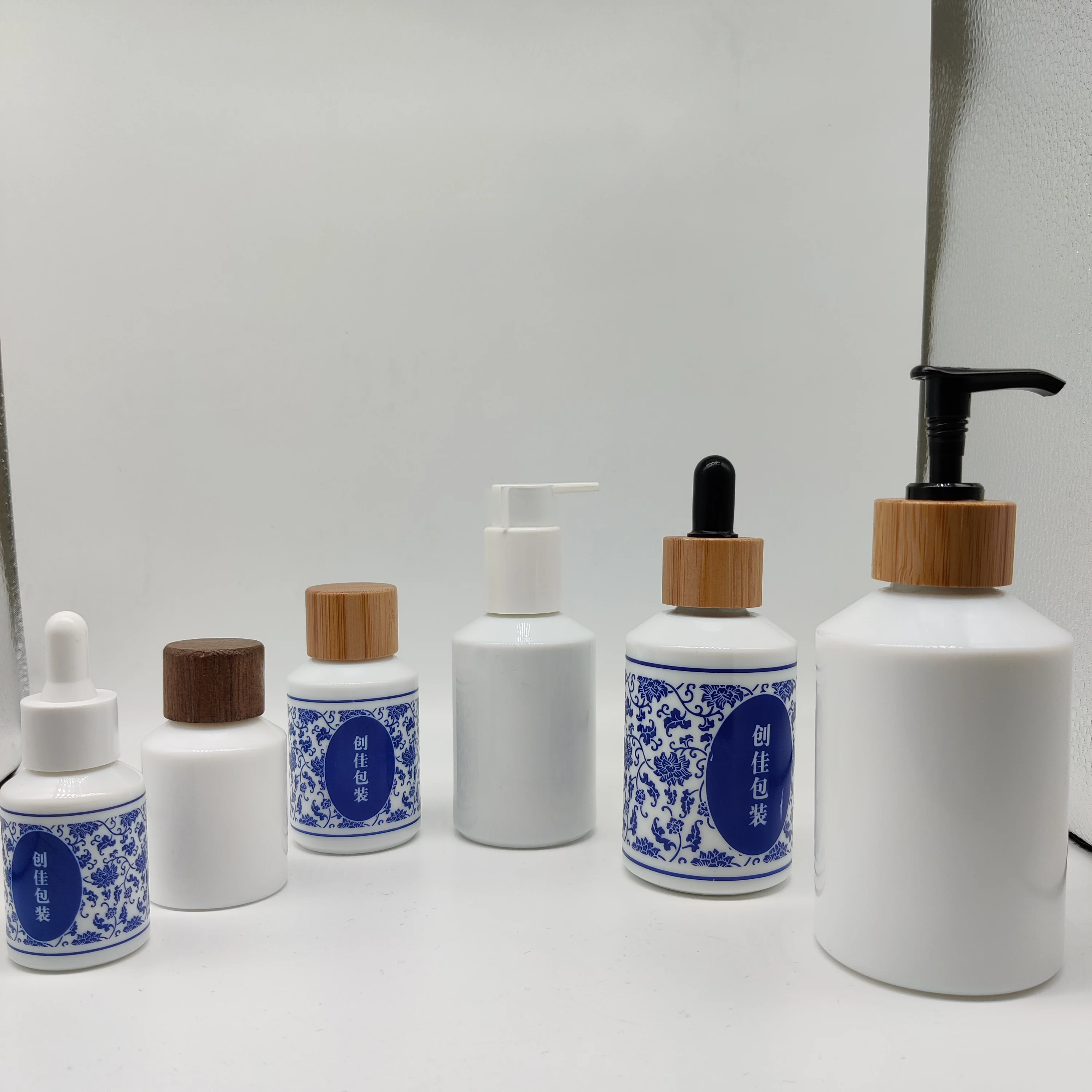 cosmetic packaging 30ml opal white essential oil glass bottle with natural wood dropper