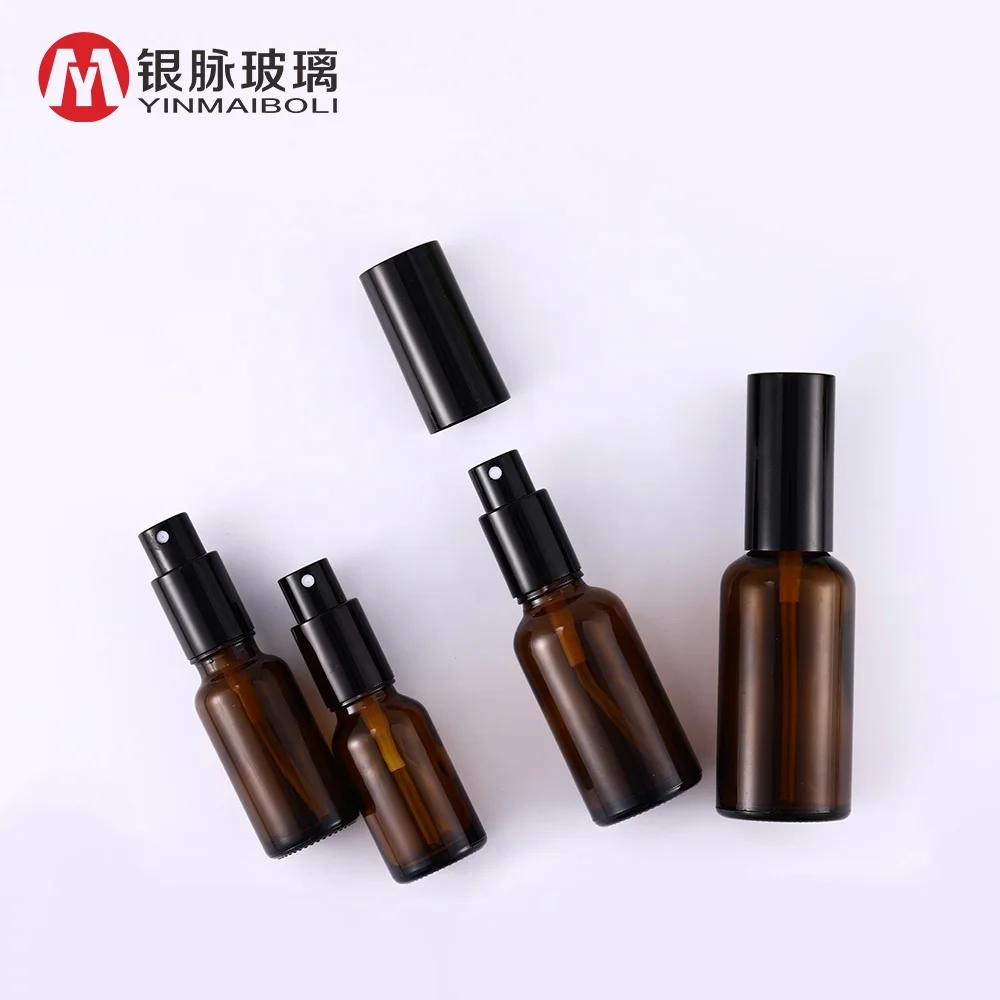 Wholesale 30ml cosmetic spray amber essential oil perfume glass bottle with black spray cap