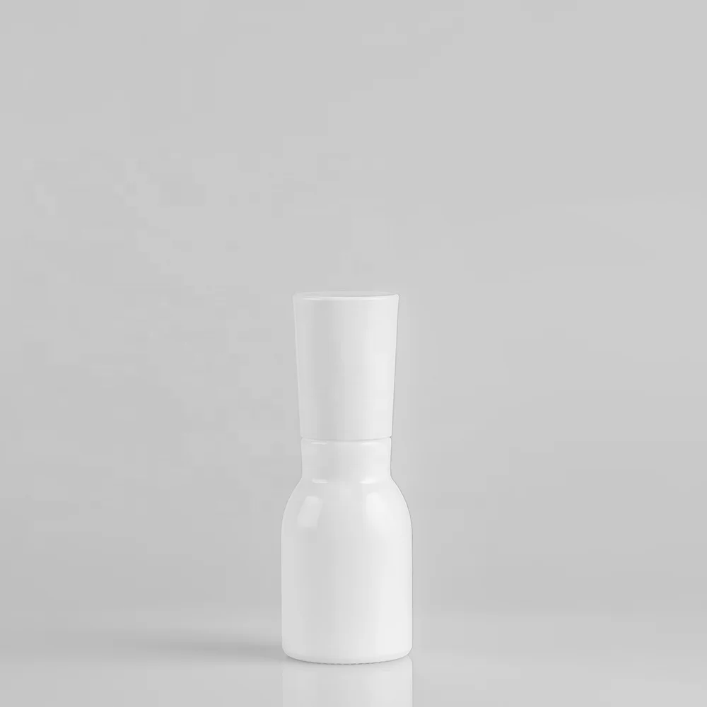 Blue glass bottle with pump and silver cap for lotion and serum