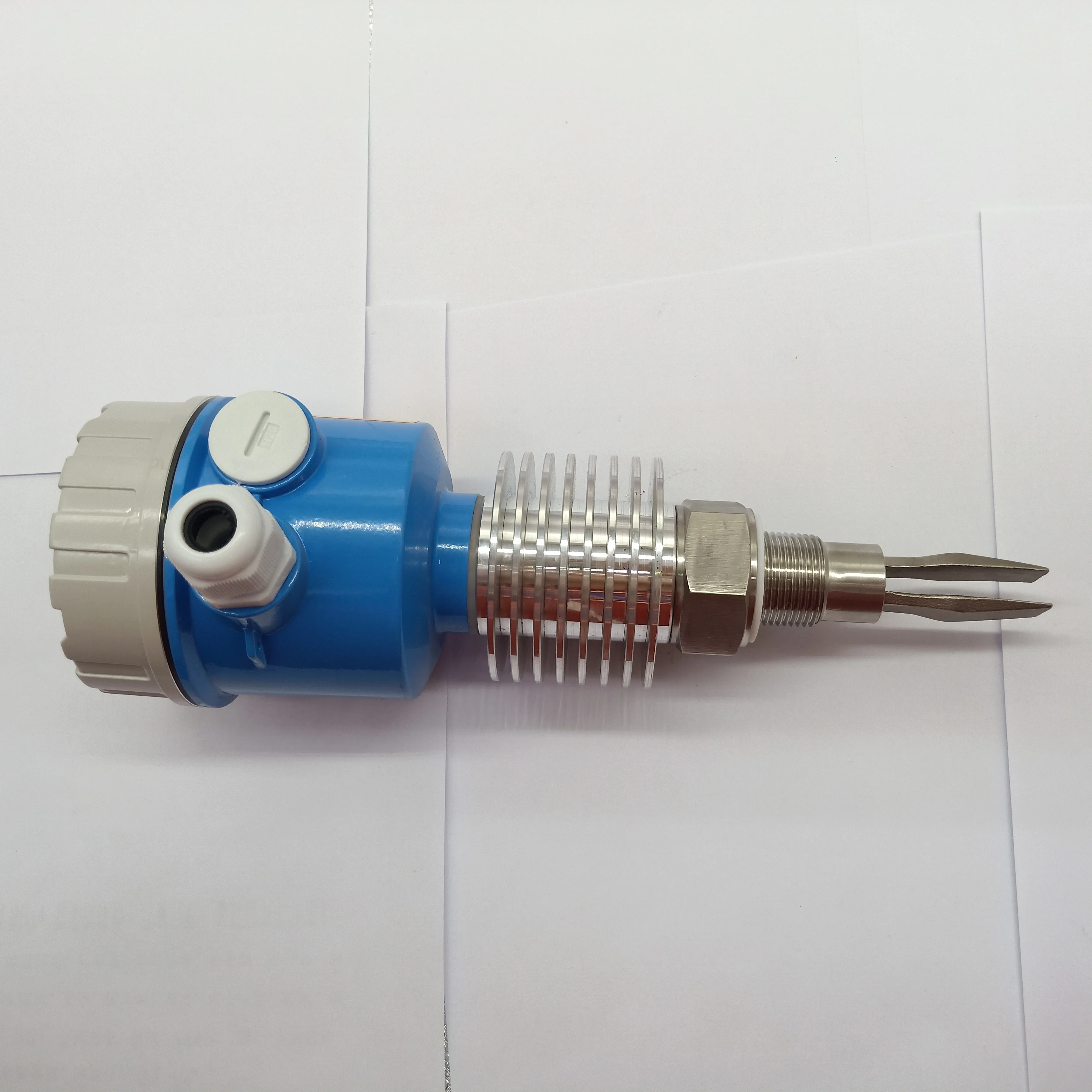 Tuning fork level switch for solid vibrating rod level switch