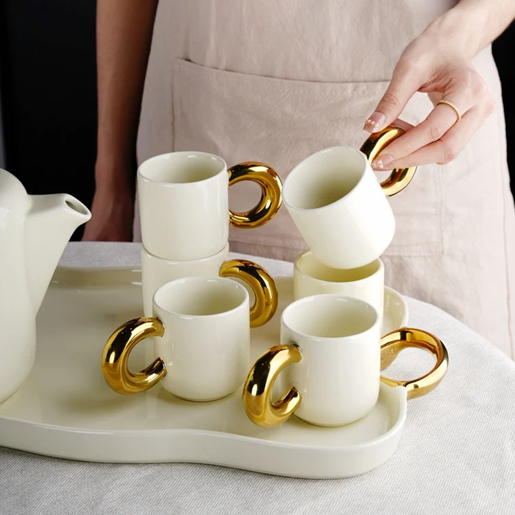 Modern nordic new design luxury gold and white ceramic set of cups tea pot and tray coffee and tea sets