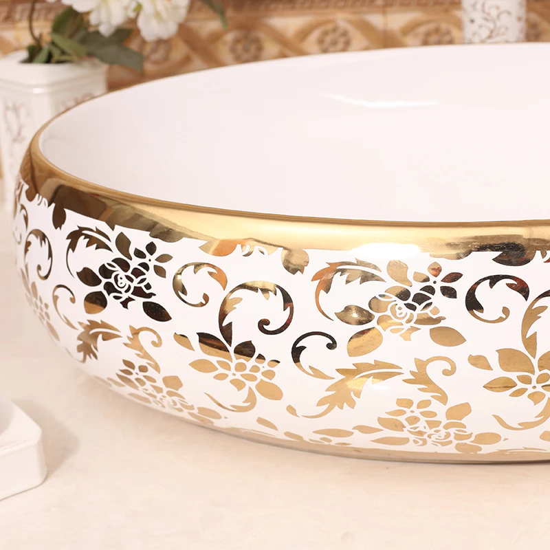 Gilded Elegance Oval Shaped Basin with Intricate Gold Designs for a Luxurious Bathroom ceramic art wash basin counter top sinks