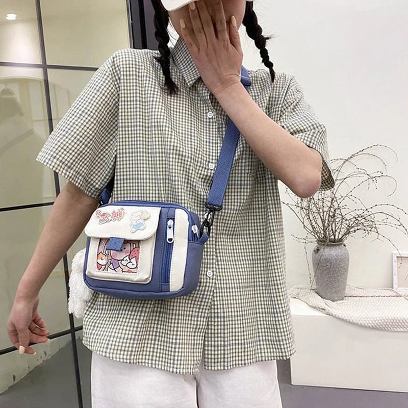 The new 2022 single shoulder slope across soft sister little girl cute nylon canvas bag bag change mobile phone lipstick female