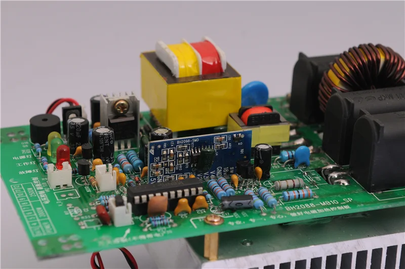 Induction heater connects coils to heat the plastic extruder