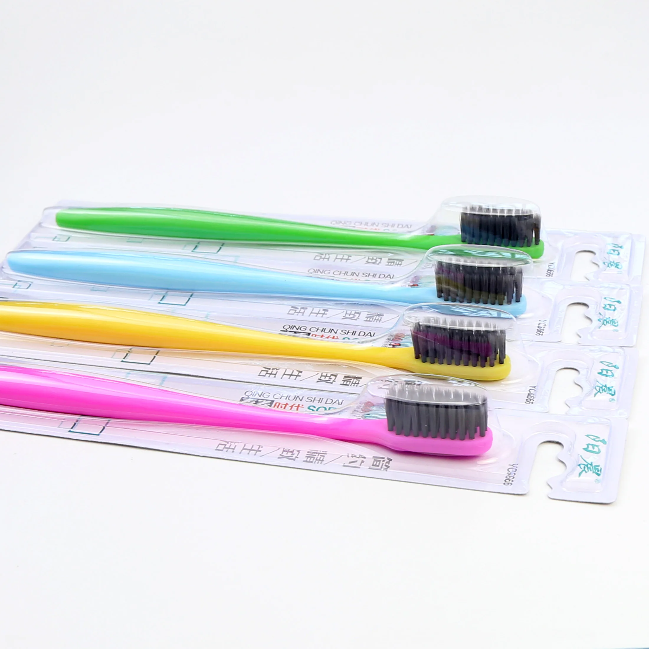 Popular Plastic Yoothbrush with Soft Charcoal Filament Individual Blister Card In one 30pcs Tray Sunny Morning Brand