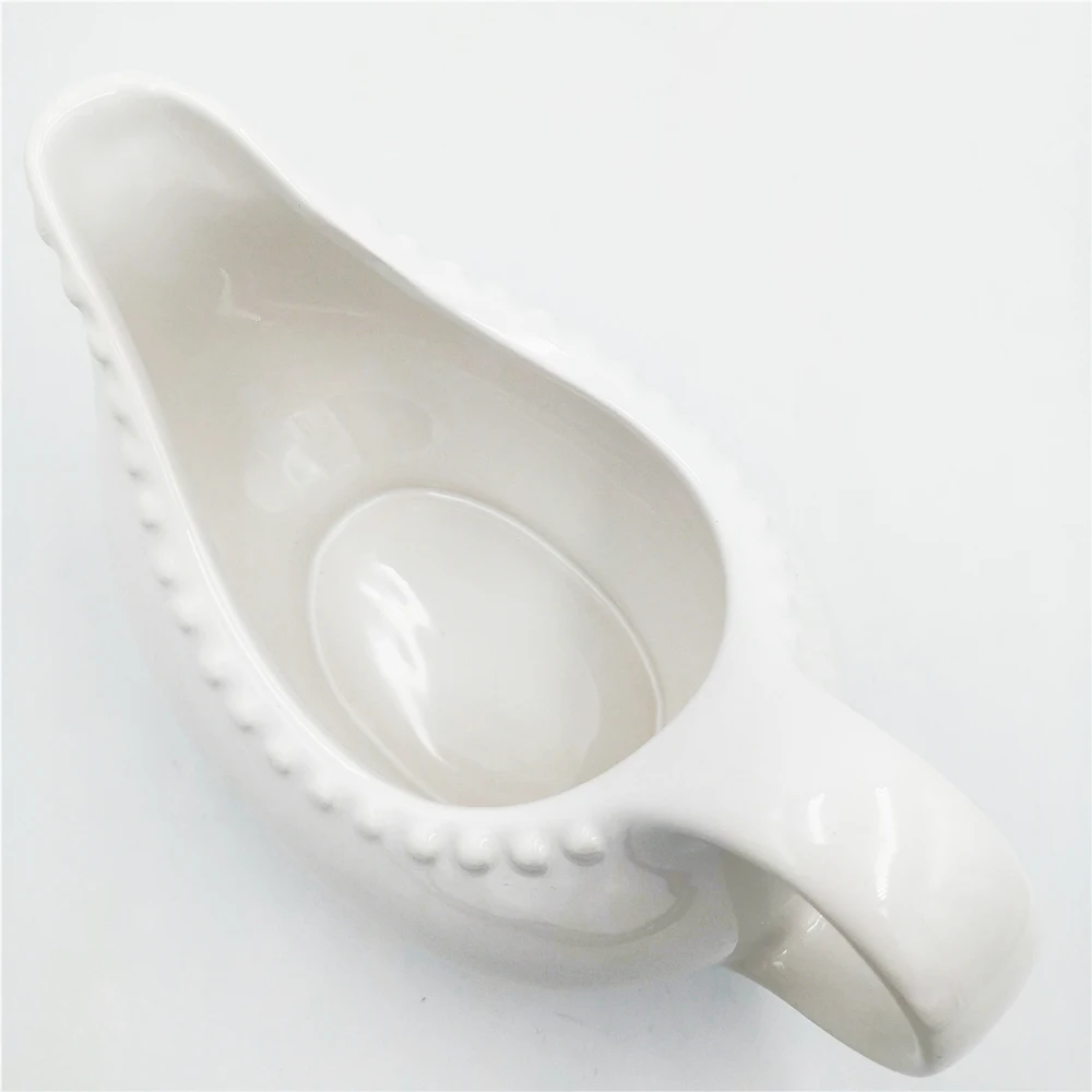Wholesale cheap embossed dot White Easy-Pour Ceramic sauce Gravy Boat with