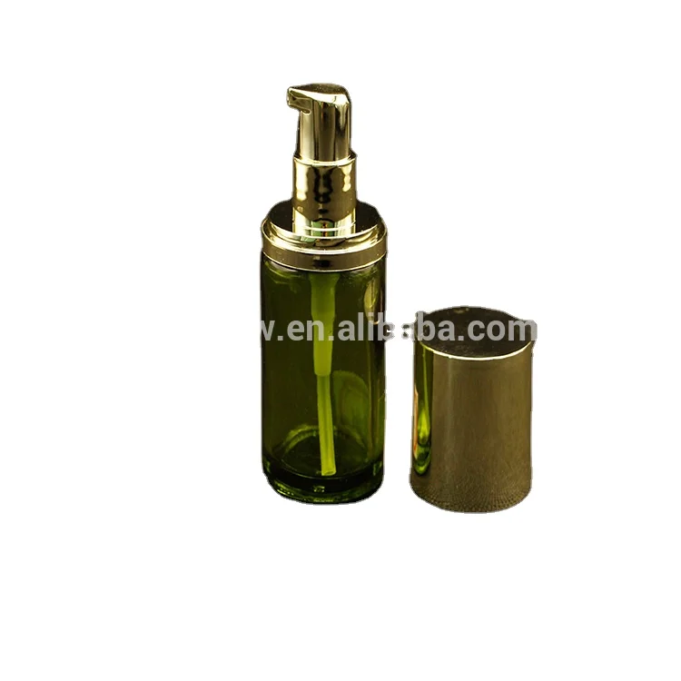 Shiny golden cream pump with glass bottle