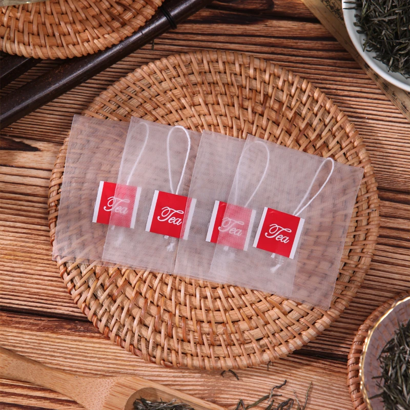 Pyramid tea bag PA nylon mesh with tag and string Triangle tea bag wholesale non-woven fabric