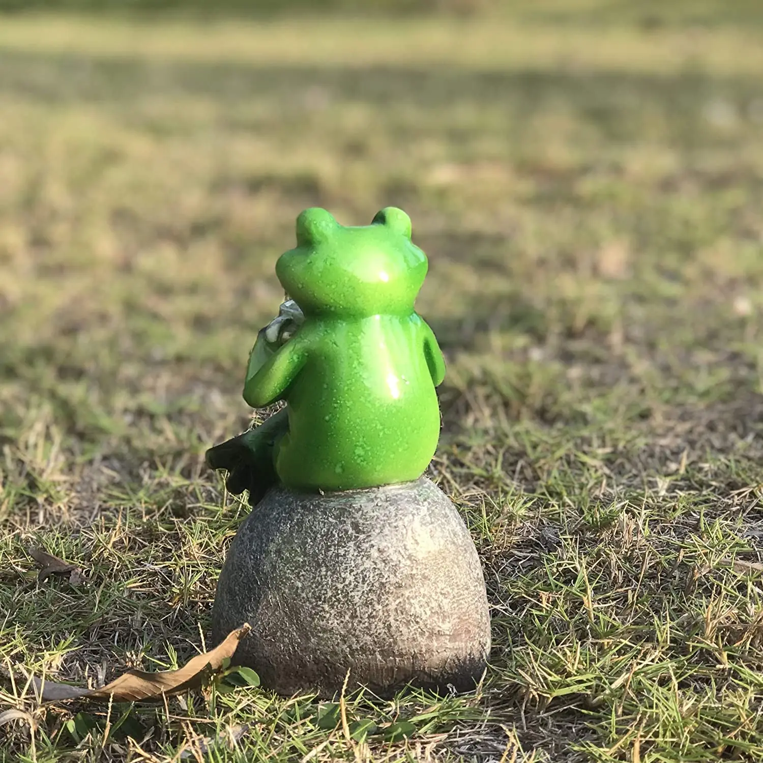 Creative Green Frog Sitting on Stone Statue Drinking Coffee