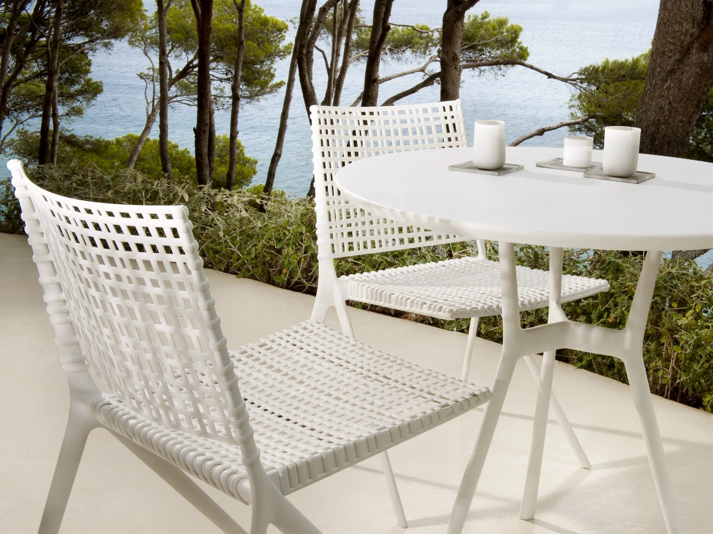 Outdoor stackable chairs with metal and rope woven seat and back for modern dining armless rope and rattan chair
