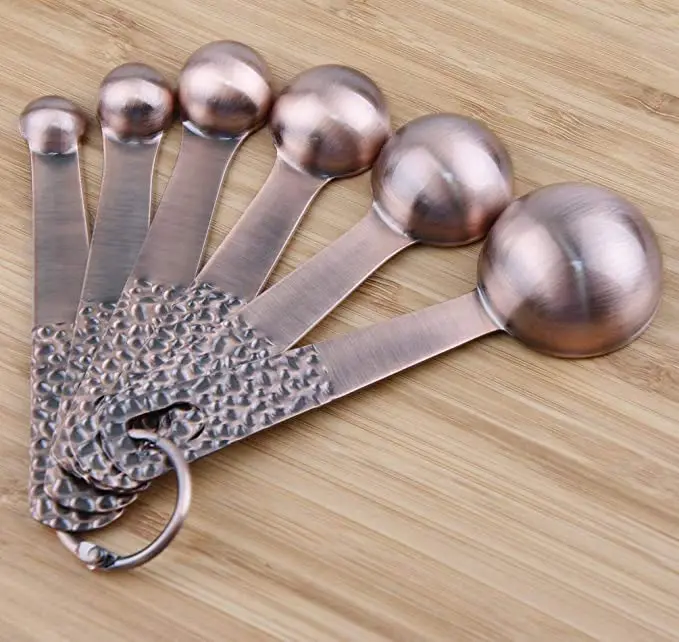  Set of 11 copper-plated stainless steel measuring cups and spoons 5 6 colored