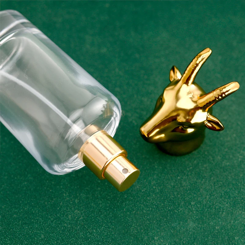 OEM Unique Wholesale 50ml Luxury Flat Empty Fragrance Glass Clear Spray Perfume Bottle With Zodiac Animal Cap