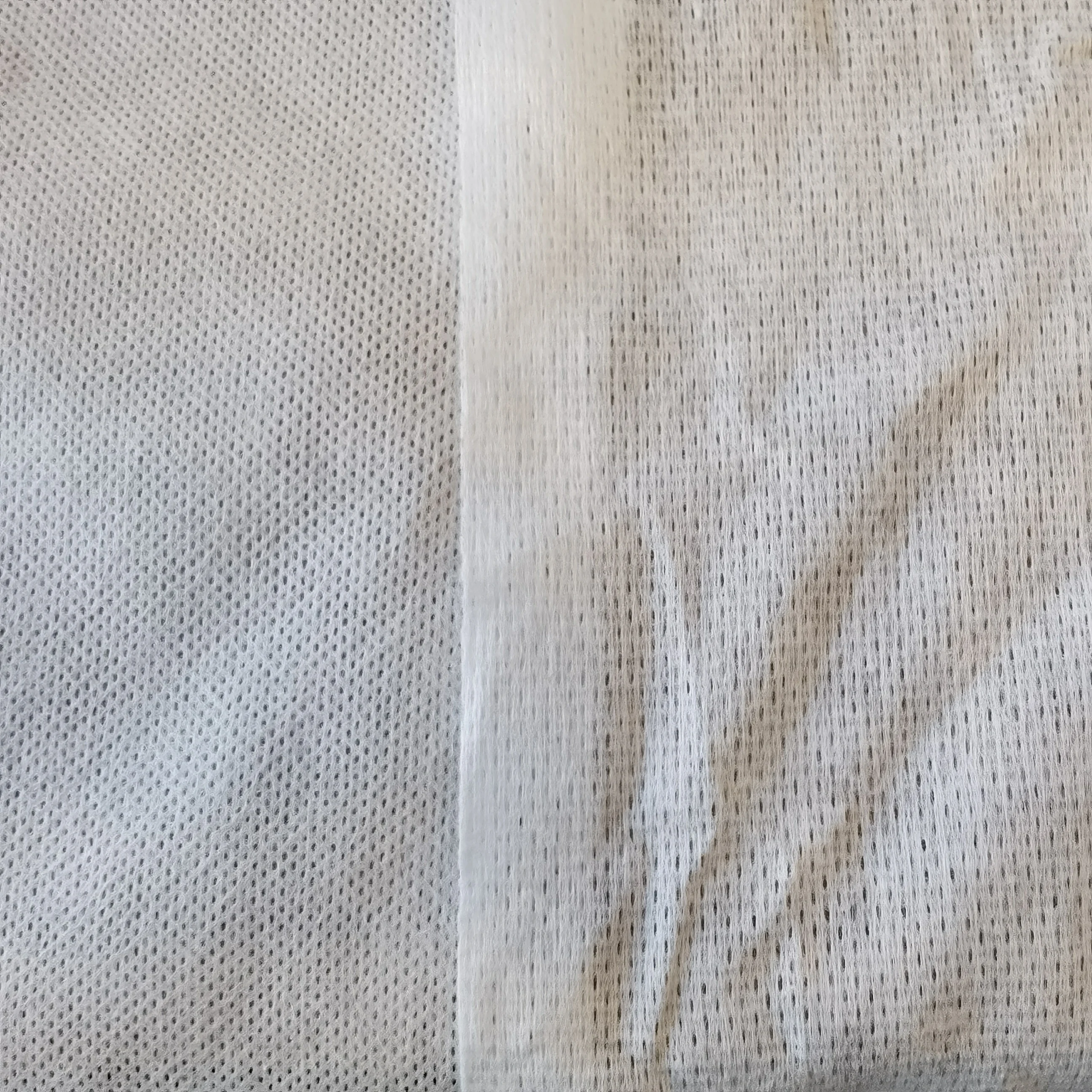 Spunlace Non Woven PP Polyethylene Viscose PET Parallel Cross Emboss Spunlace Nonwoven  Fabric Factory  for Personal Care