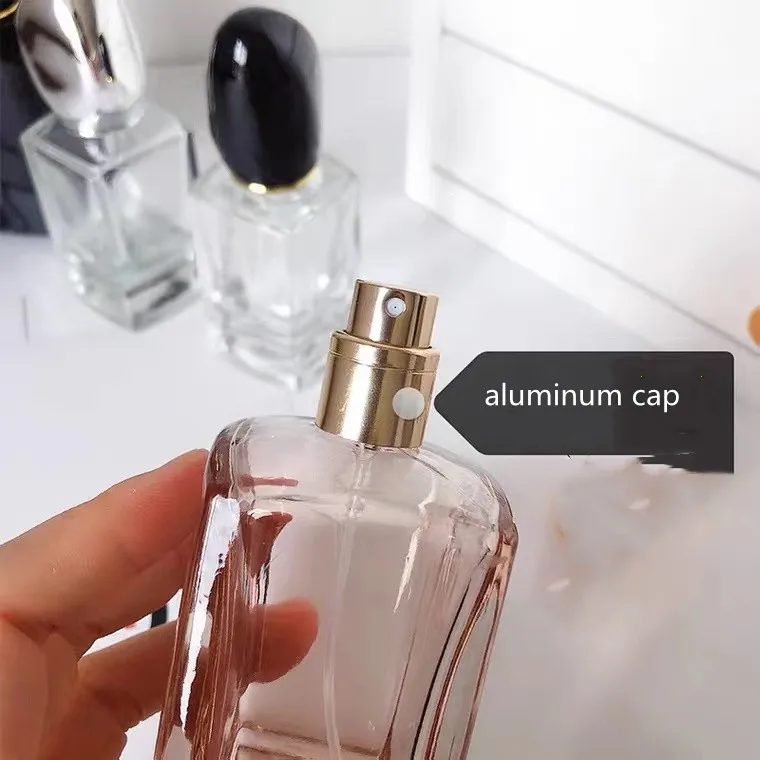 LOW MOQ Rectangle 30ML/50ML thick bottom orange colored perfume bottle with fancy lid