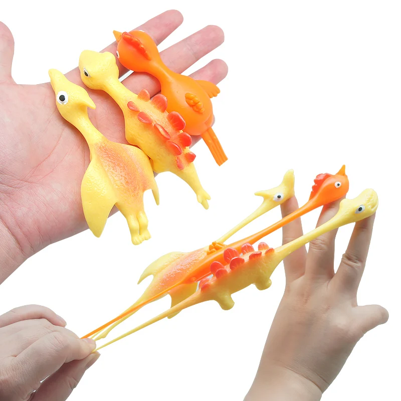 Hot Sale TPR Material High Quality Promotion TPR Dinosaur Toy Slingshot Catapult Toys Small Children Toys
